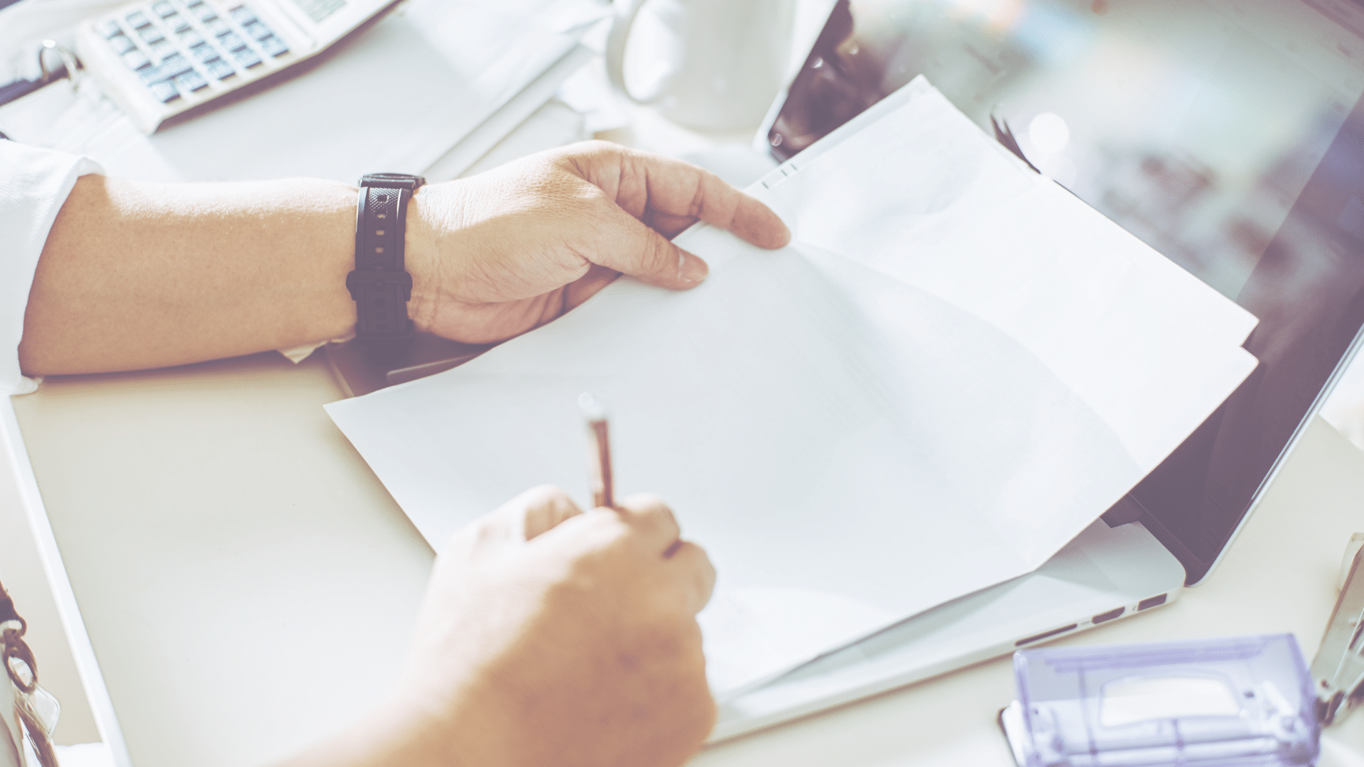 taxassist hero image - picture of a accountant working at a desk