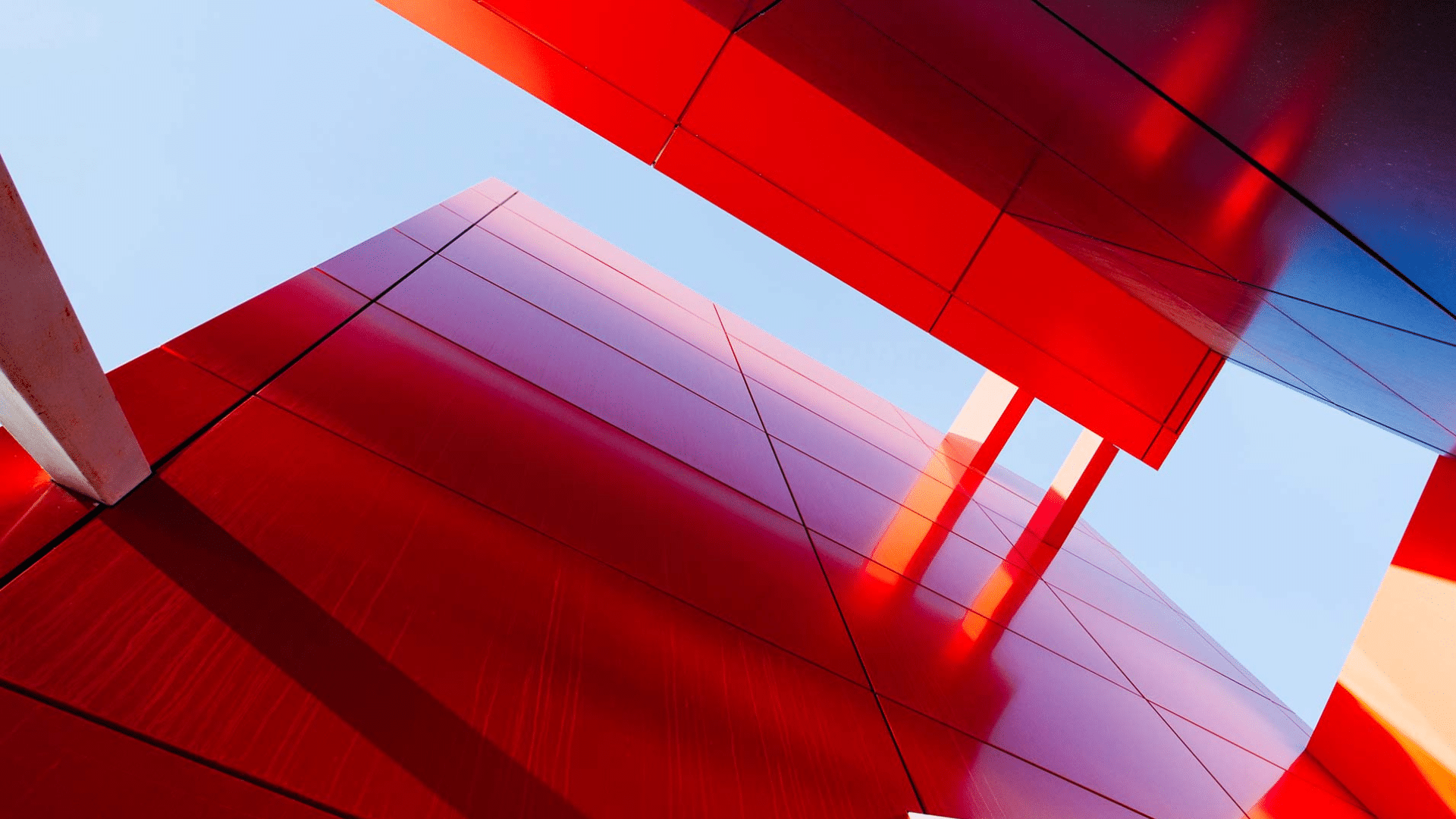 BackUp Solutions hero image - red building against blue sky